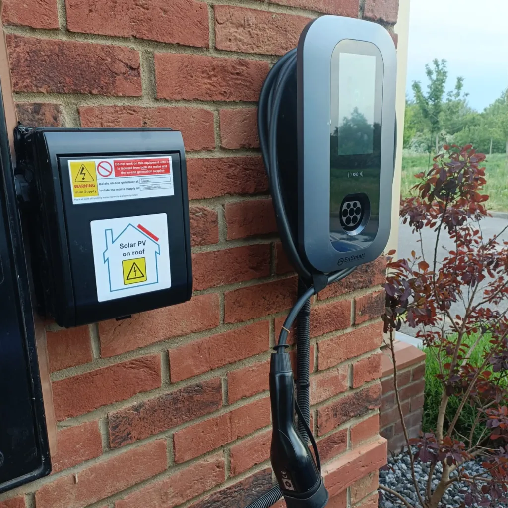 Wall-mounted EnSmart EV charger installed by Home Comfort Enterprises
