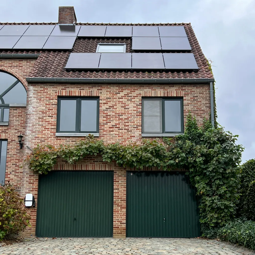 Solar panels installed on a residential roof by Home Comfort Enterprises