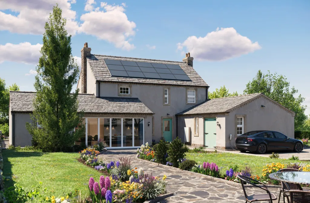 Tesla Powerwall 3 on the wall of a UK stone cottage with a solar roof (manufacturer image)